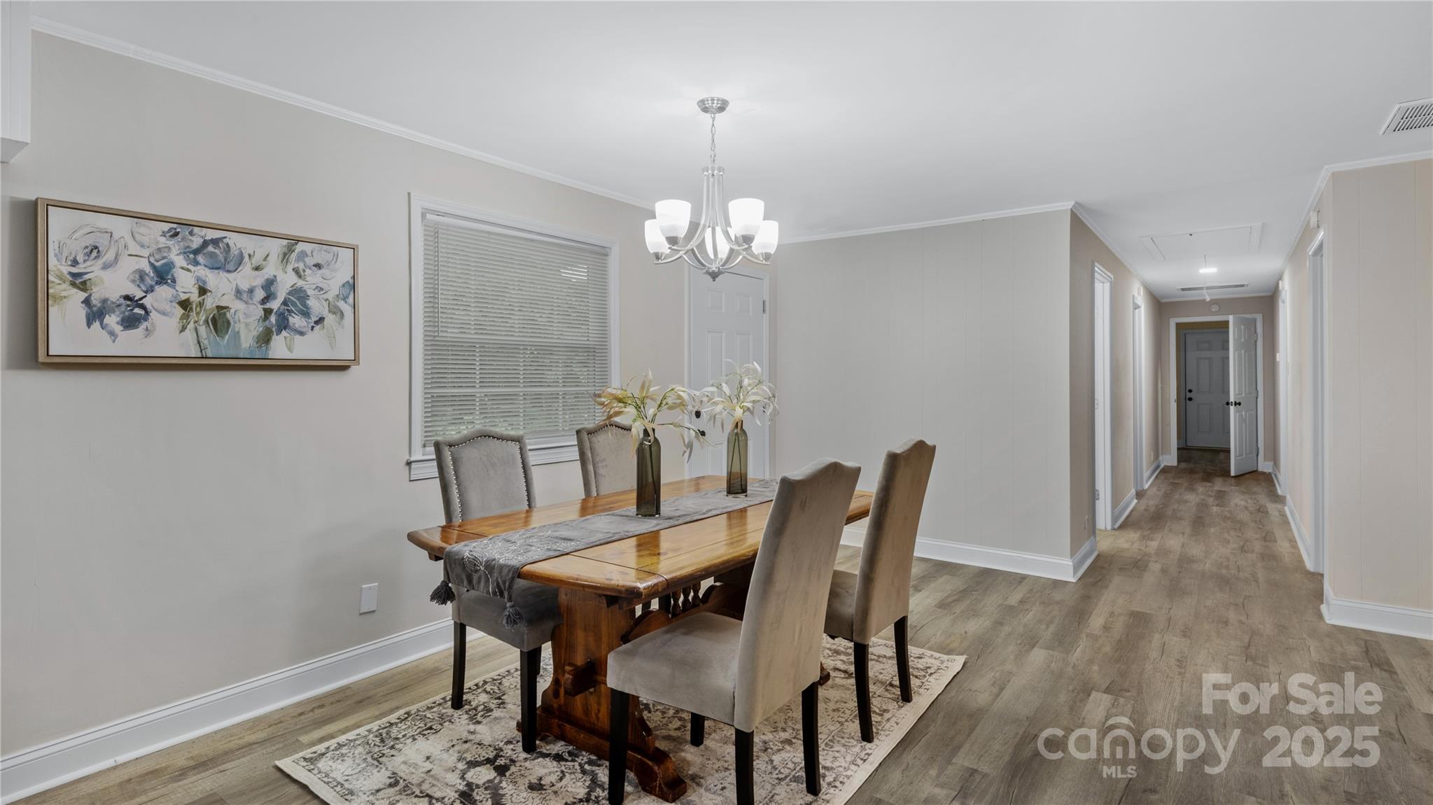 7860 Henry Harris Road Fort Mill, SC 29707 - Photo 5 of 31 a view of a dining room with furniture and chandelier