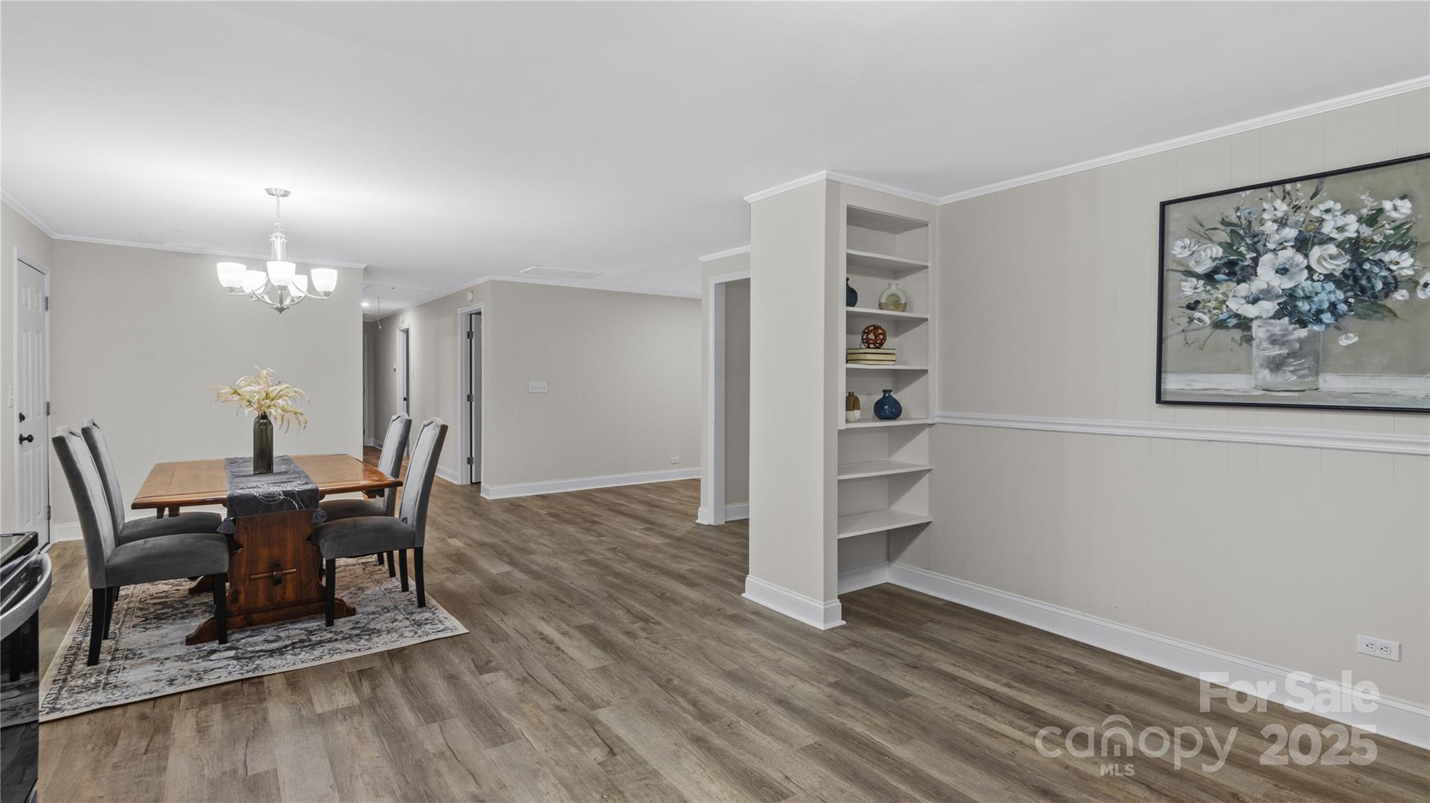 7860 Henry Harris Road Fort Mill, SC 29707 - Photo 9 of 31 a view of a dining room with furniture and wooden floor