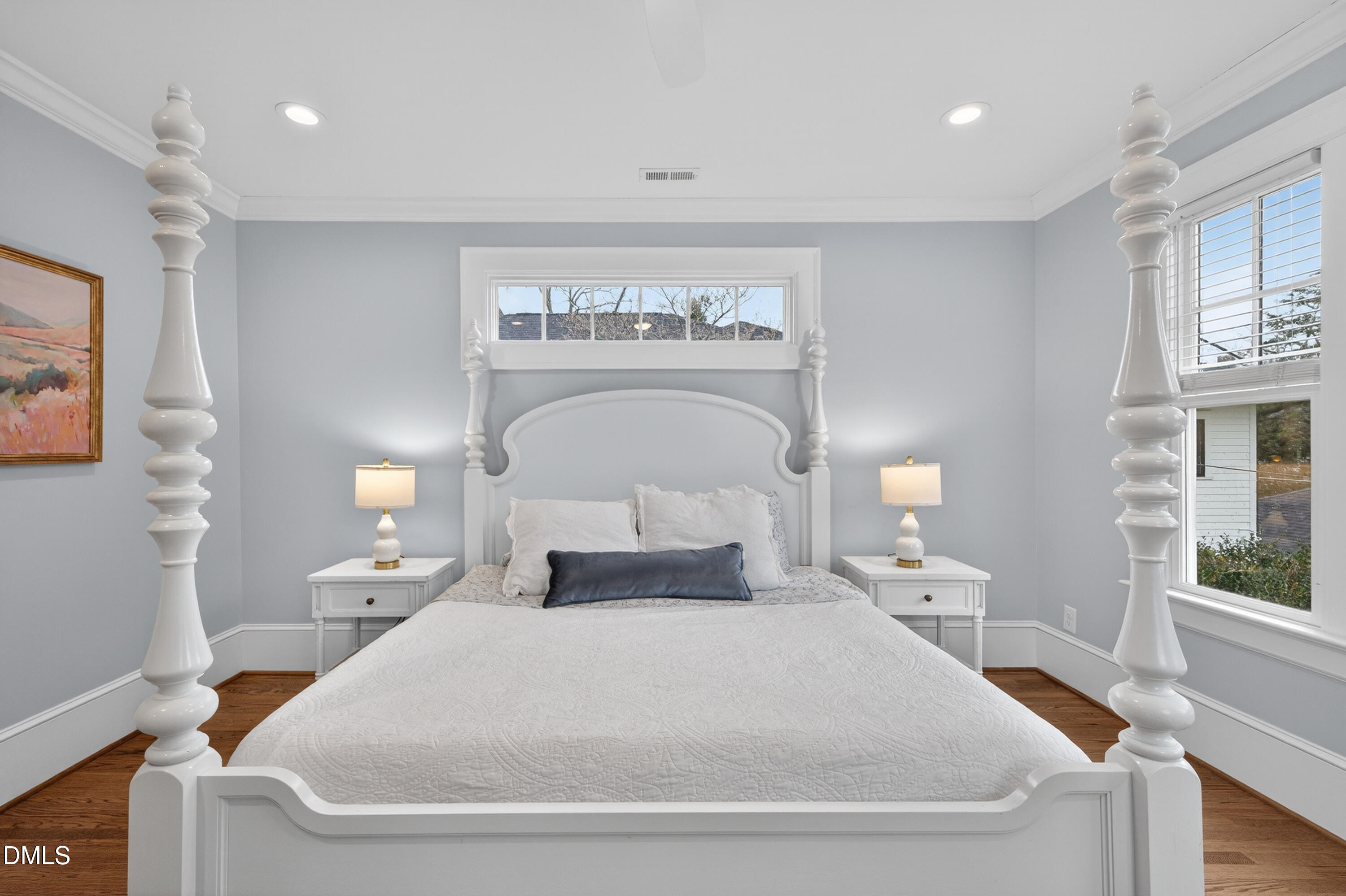 205 Woodburn Road Raleigh, NC 27605 - Photo 21 of 46 a bedroom with a bed and a large window