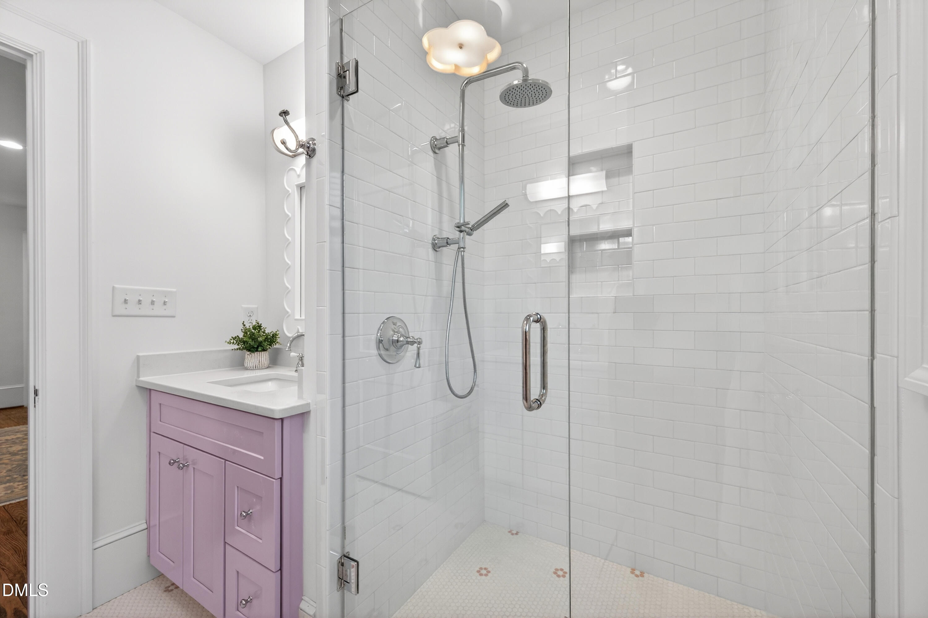 205 Woodburn Road Raleigh, NC 27605 - Photo 29 of 46 a bathroom with a shower a sink and mirror