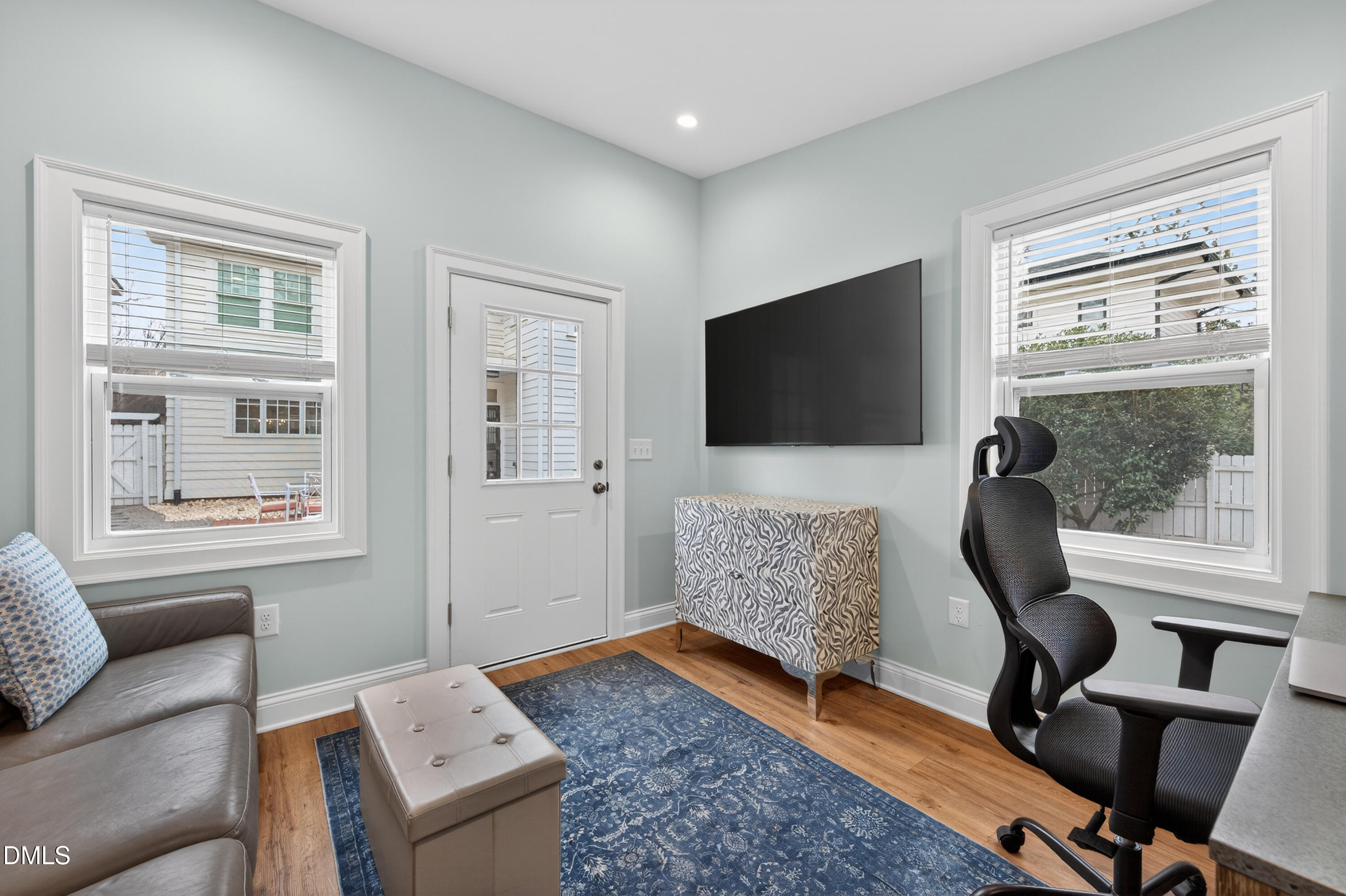205 Woodburn Road Raleigh, NC 27605 - Photo 39 of 46 a living room with furniture and a flat screen tv