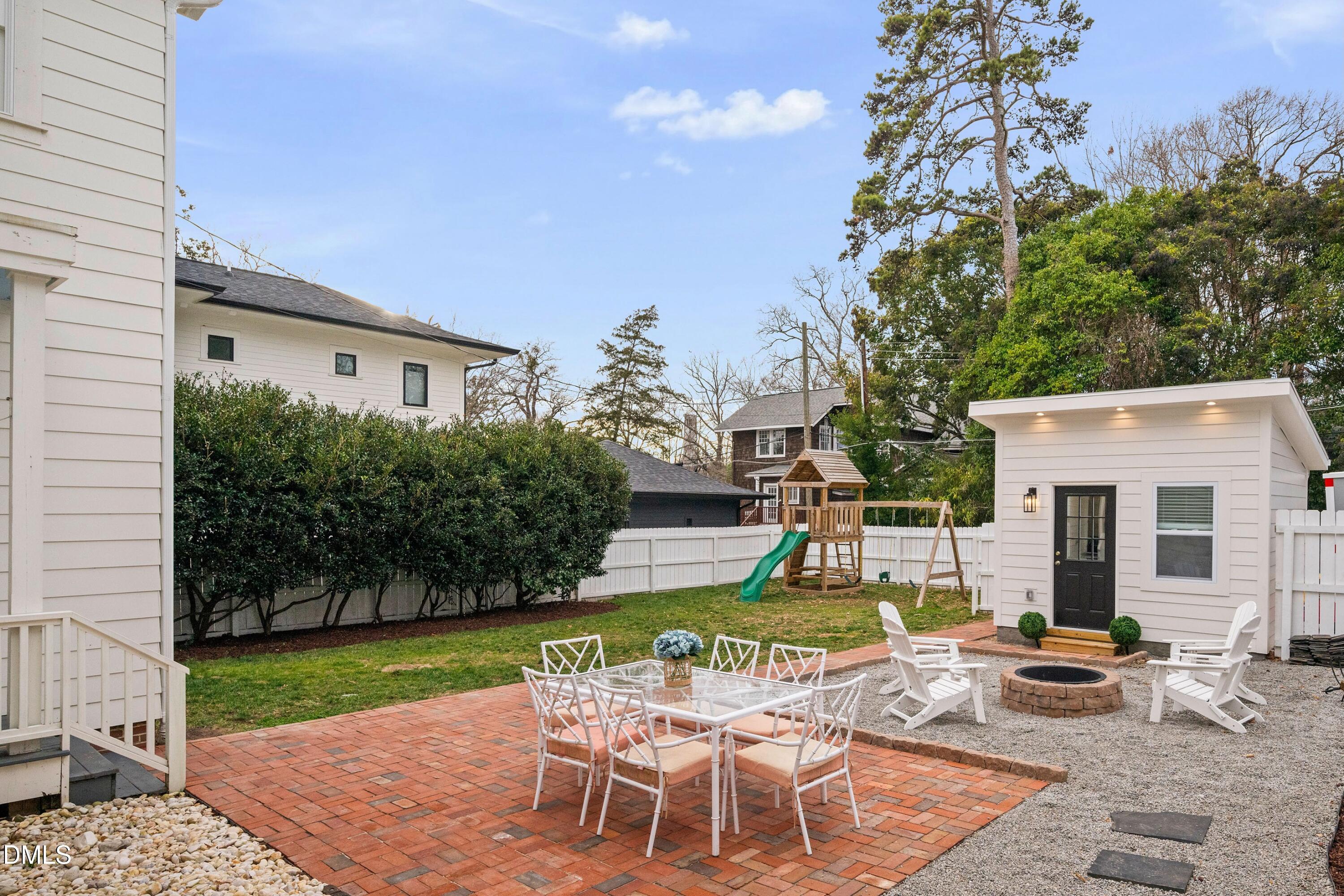 205 Woodburn Road Raleigh, NC 27605 - Photo 40 of 46 a view of a house with backyard and sitting area