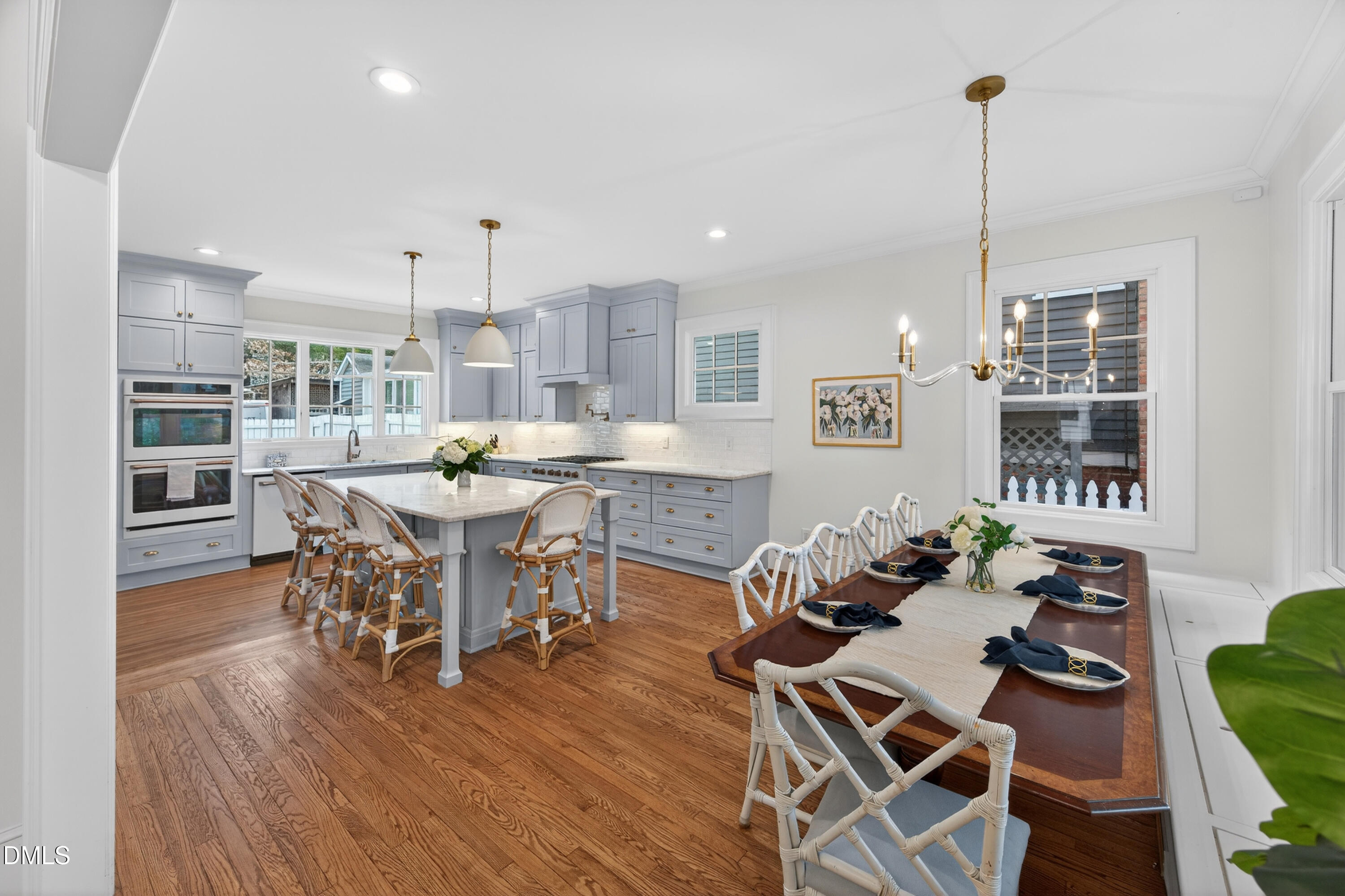 205 Woodburn Road Raleigh, NC 27605 - Photo 9 of 46 a view of a dining room with furniture window and wooden floor