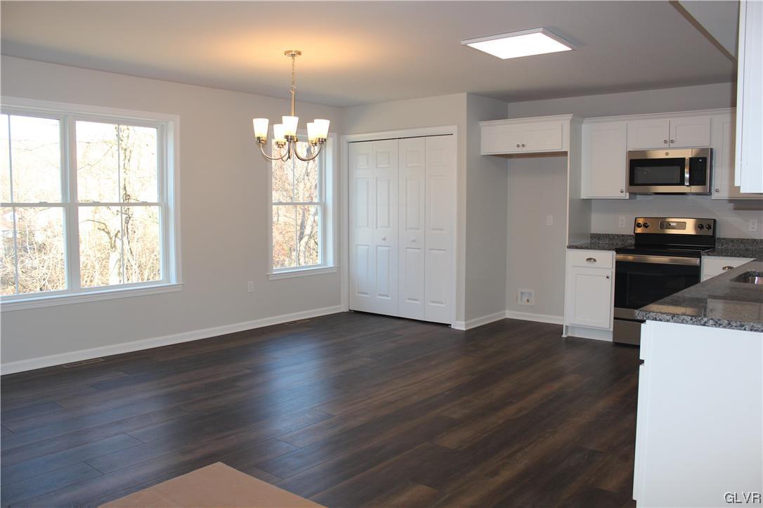 1604 Clauser Street Hellertown, PA 18055 - Photo 3 of 14 an empty room with wooden floor and windows