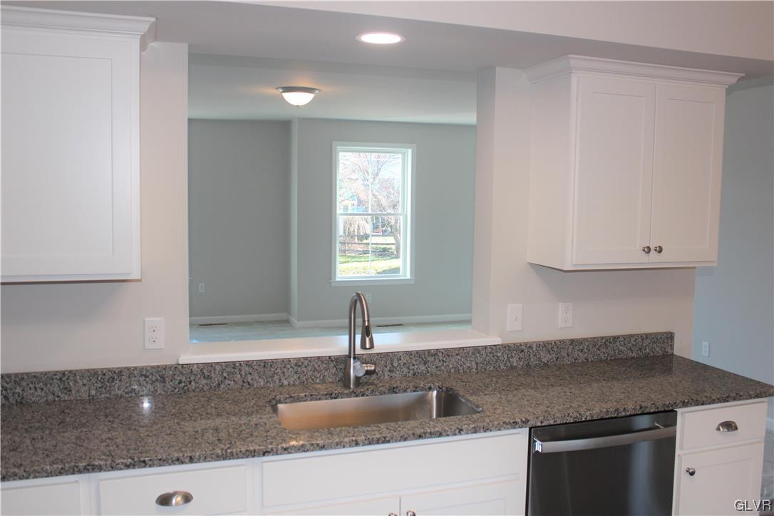 1604 Clauser Street Hellertown, PA 18055 - Photo 5 of 14 a kitchen with granite countertop a sink and a stove