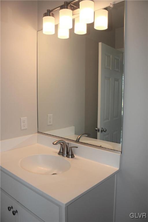 1604 Clauser Street Hellertown, PA 18055 - Photo 8 of 14 a bathroom with a sink and a mirror