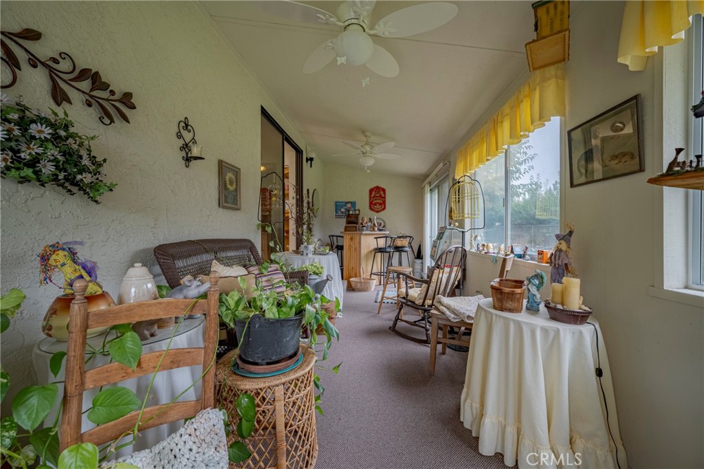 4263 Gurr Road Atwater, CA 95301 - Photo 32 of 73 a living room with furniture fireplace and a chandelier