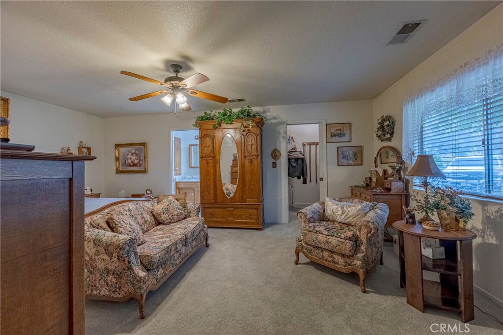4263 Gurr Road Atwater, CA 95301 - Photo 35 of 73 a living room with furniture and a chandelier