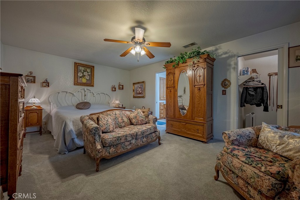 4263 Gurr Road Atwater, CA 95301 - Photo 36 of 73 a living room with furniture and a chandelier