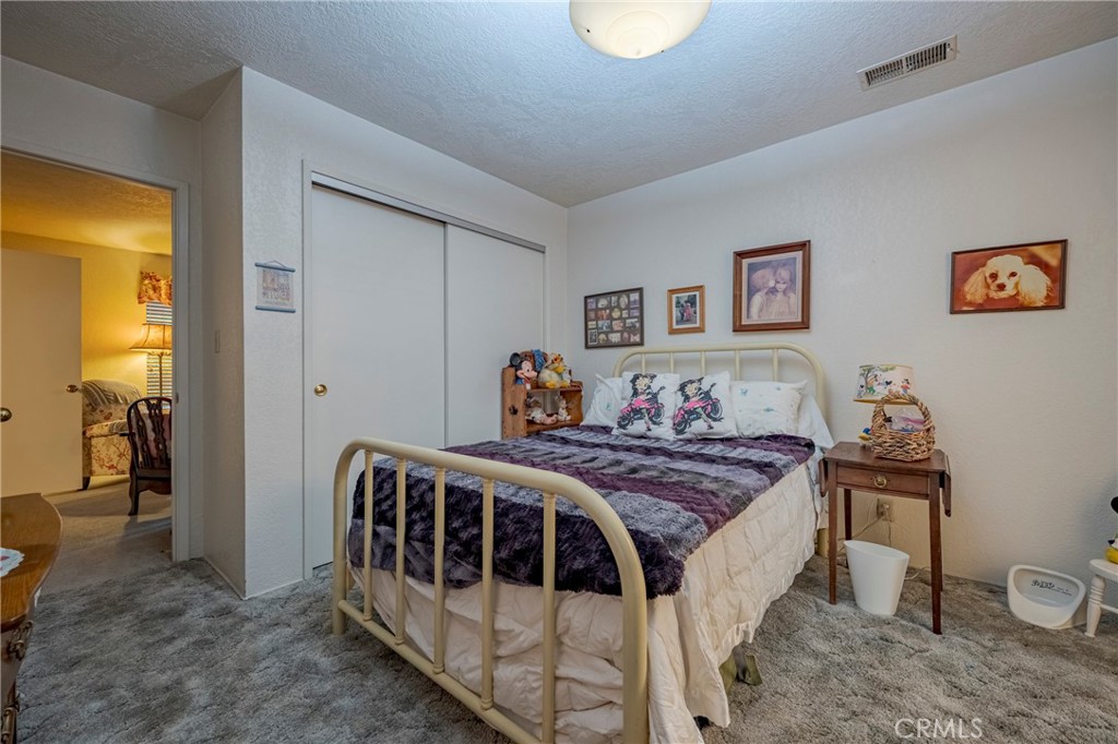 4263 Gurr Road Atwater, CA 95301 - Photo 44 of 73 a bedroom with a bed and a table in it