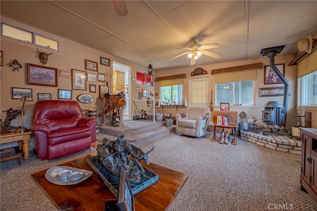 4263 Gurr Road Atwater, CA 95301 - Photo 50 of 73 a living room with furniture a chandelier and a dining table