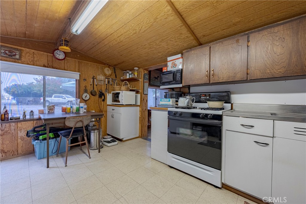 4263 Gurr Road Atwater, CA 95301 - Photo 59 of 73 a kitchen with appliances cabinets and furniture