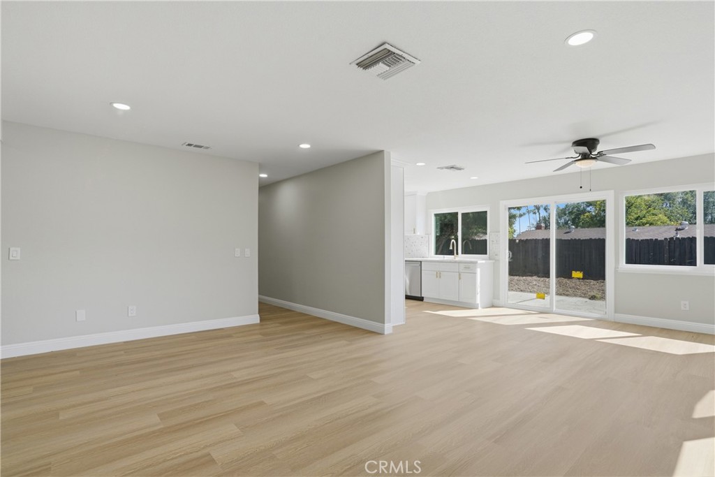 2924 Louisiana Place Riverside, CA 92506 - Photo 14 of 42 a view of an empty room with wooden floor and a window