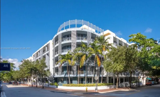 a front view of a building with a yard