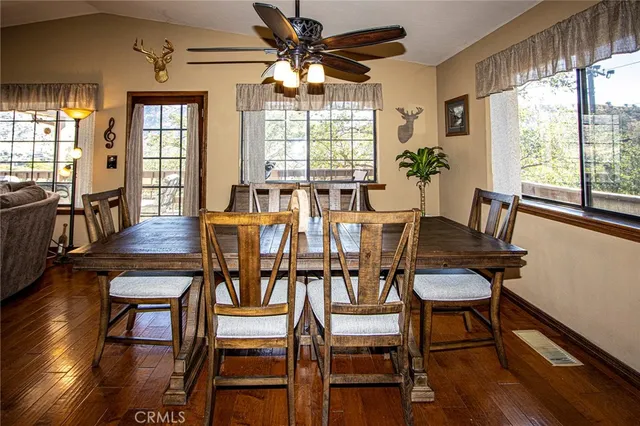 a view of water heater room with wooden floor