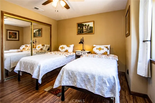 a en suite bathroom with a granite countertop sink and a mirror