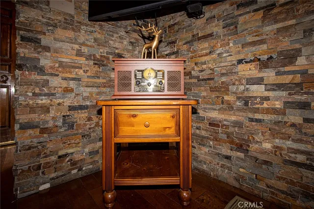 a table with chairs and wooden floor