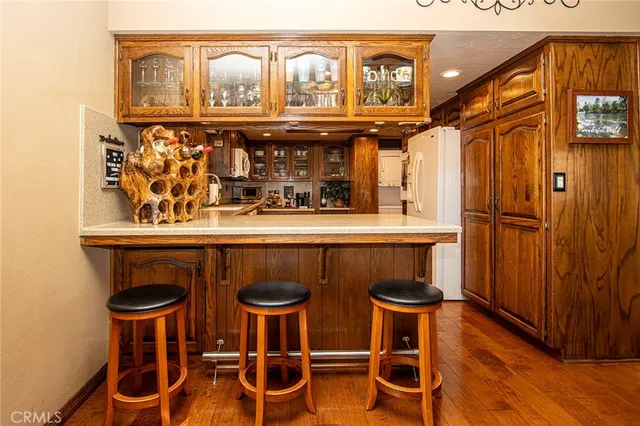 a room with furniture pool table and flat screen tv