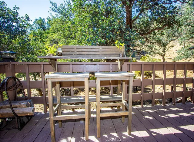 a view of a backyard with a tree