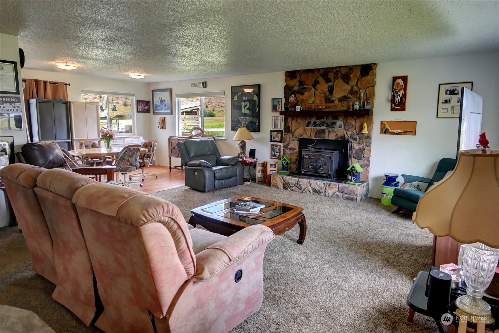 20325A State Rte 20, Unit A Twisp, WA 98856 - Photo 17 of 34 a living room with furniture fireplace and a flat screen tv