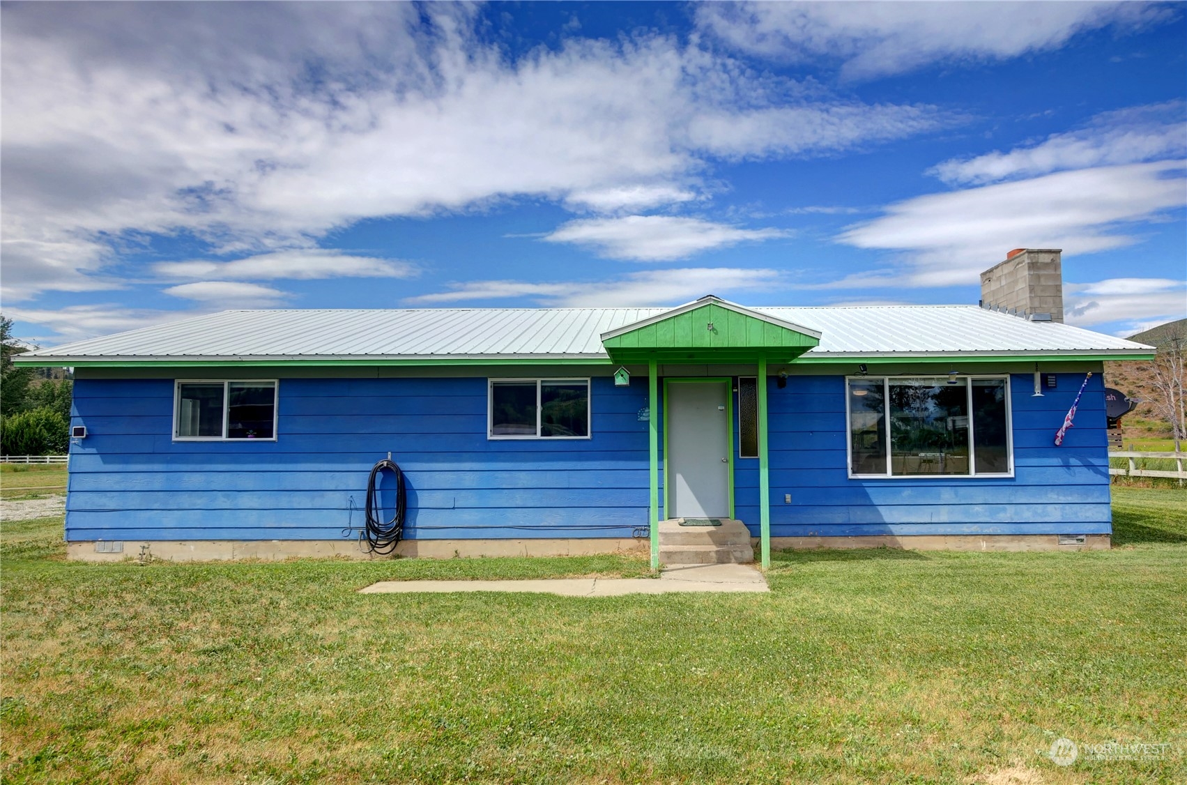 20325A State Rte 20, Unit A Twisp, WA 98856 - Photo 2 of 34 a front view of a house with a yard