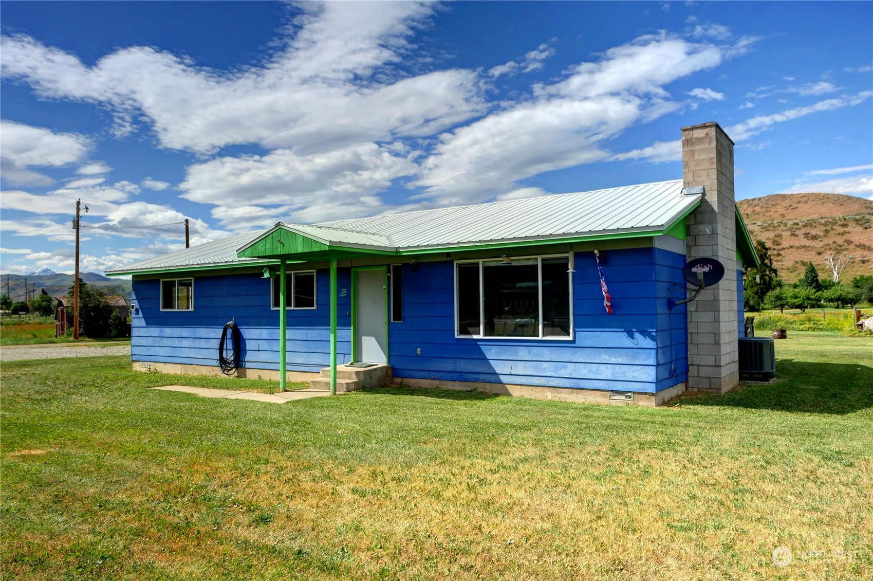 20325A State Rte 20, Unit A Twisp, WA 98856 - Photo 30 of 34 a view of a house with a yard potted plants and a table