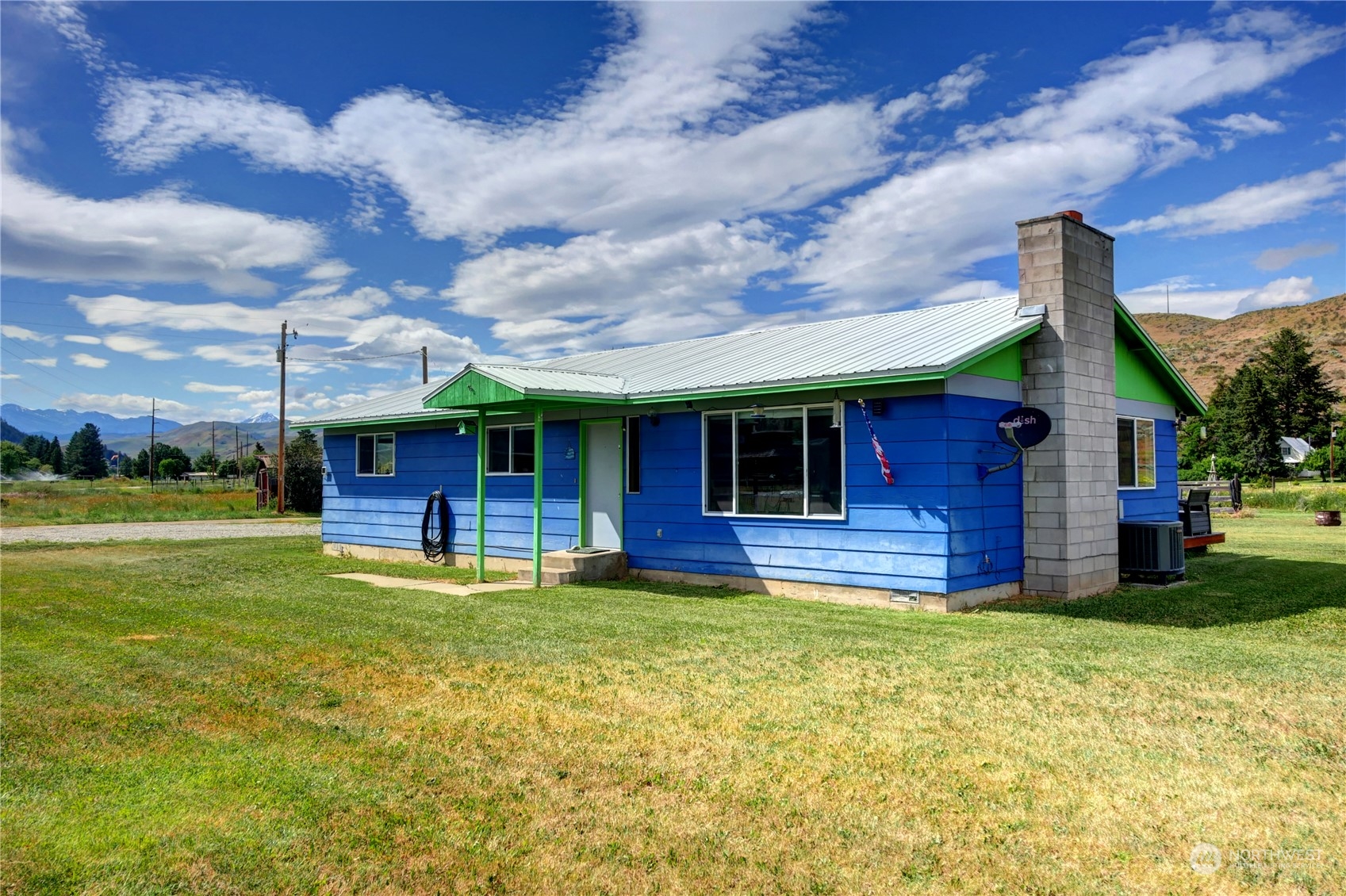 20325A State Rte 20, Unit A Twisp, WA 98856 - Photo 3 of 34 a view of a house with a swimming pool and a yard