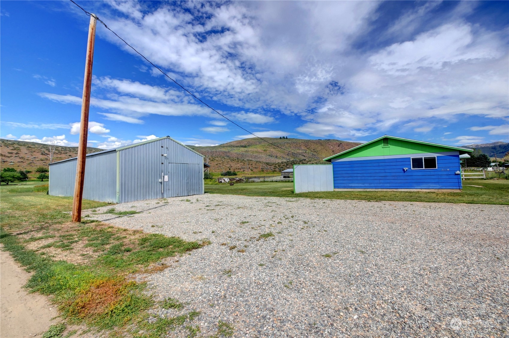 20325A State Rte 20, Unit A Twisp, WA 98856 - Photo 4 of 34 a big yard with table and wooden fence