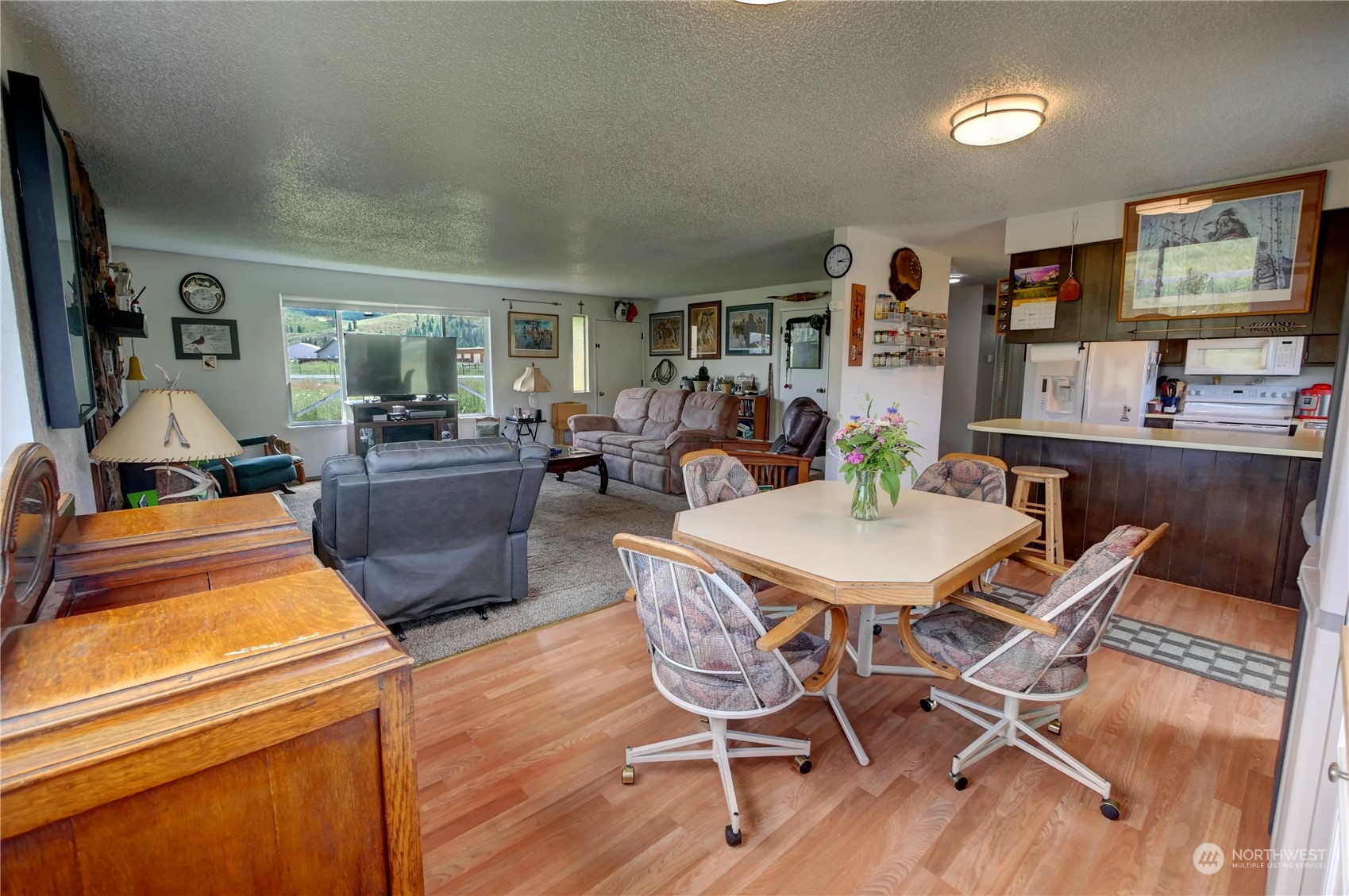 20325A State Rte 20, Unit A Twisp, WA 98856 - Photo 7 of 34 a view of a dining room with furniture window and wooden floor