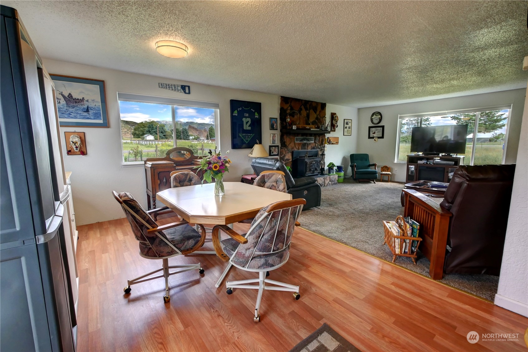 20325A State Rte 20, Unit A Twisp, WA 98856 - Photo 8 of 34 a view of a dining room with furniture window and wooden floor