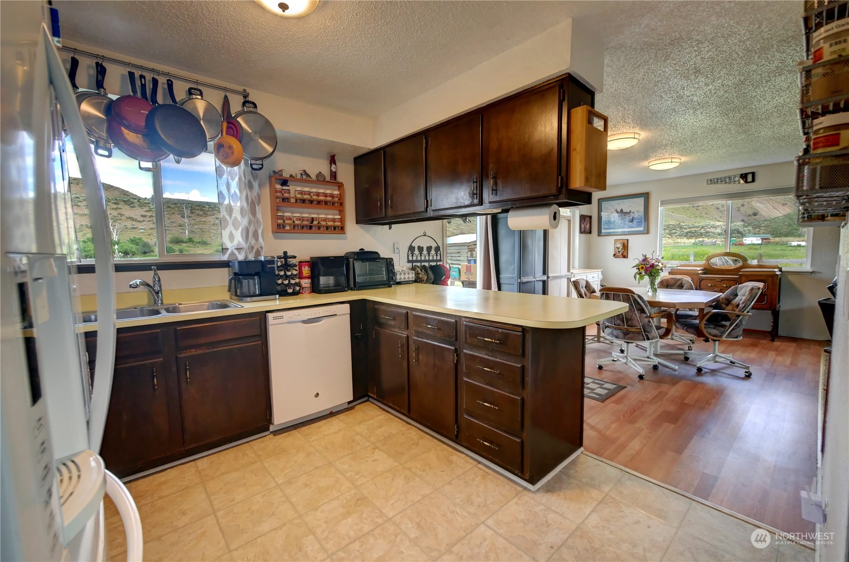 20325A State Rte 20, Unit A Twisp, WA 98856 - Photo 10 of 34 a kitchen with stainless steel appliances granite countertop a sink counter space cabinets and a flat screen tv