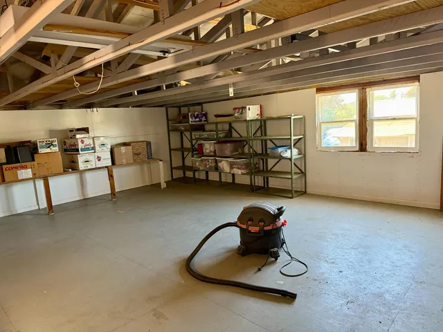 a view of a patio with table and chairs