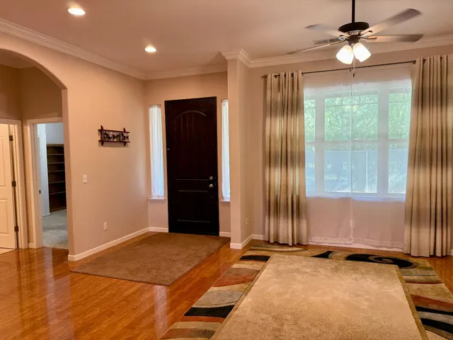 a spacious bathroom with a granite countertop sink mirror and vanity