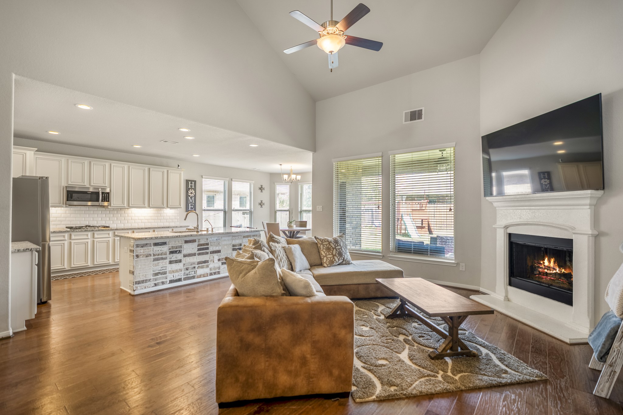 23006 Mulberry Tree Lane Spring, TX 77389 - Photo 12 of 50 a living room with fireplace furniture and a flat screen tv