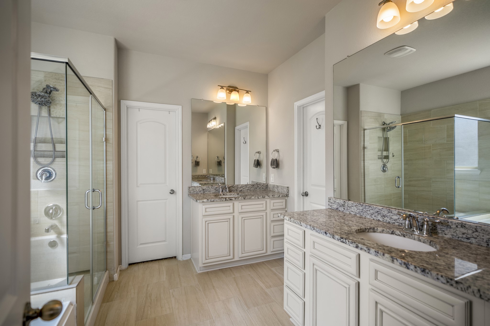 23006 Mulberry Tree Lane Spring, TX 77389 - Photo 23 of 50 a bathroom with a granite countertop sink mirror and double