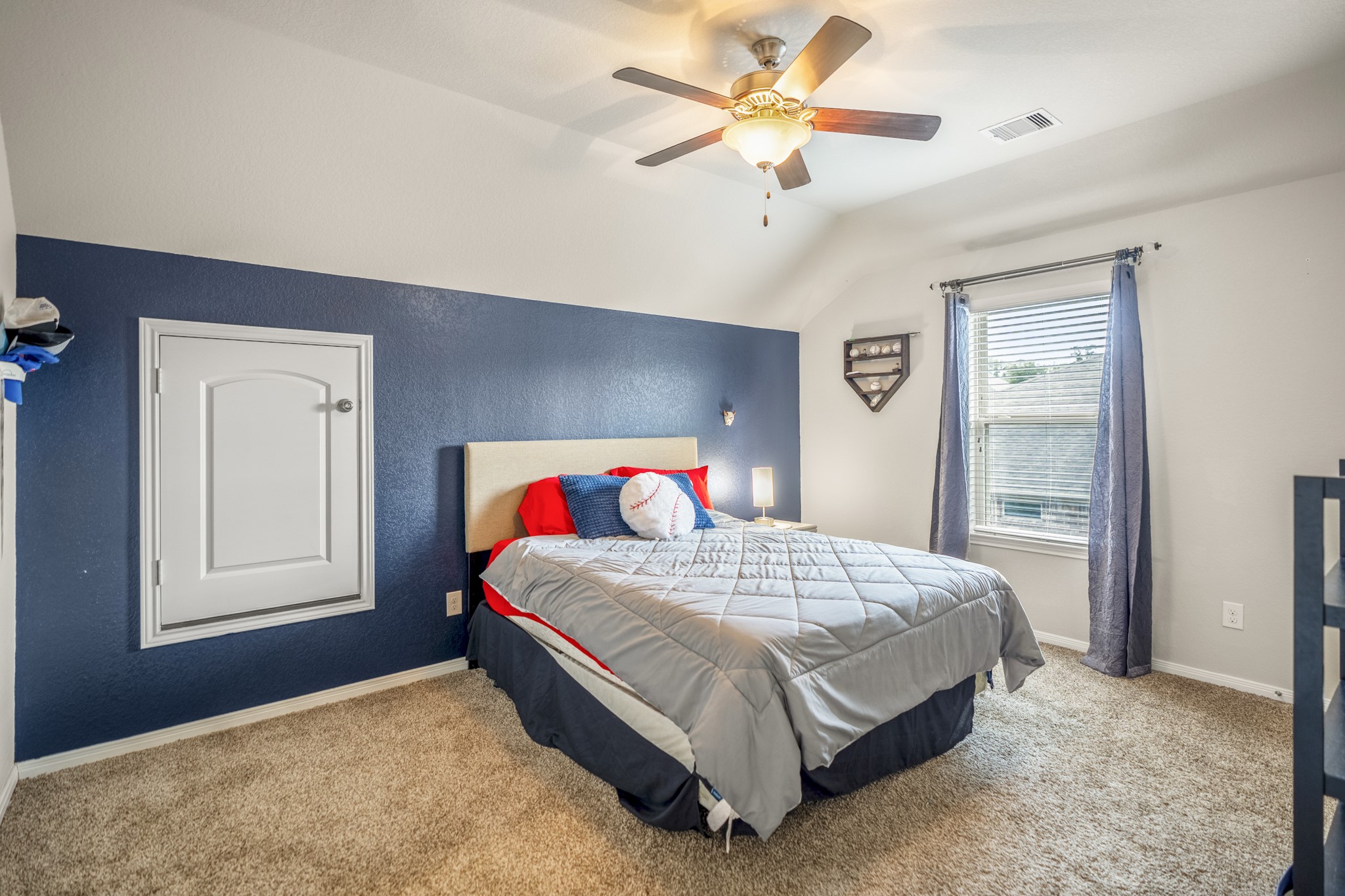 23006 Mulberry Tree Lane Spring, TX 77389 - Photo 32 of 50 a bedroom with a bed and a chandelier