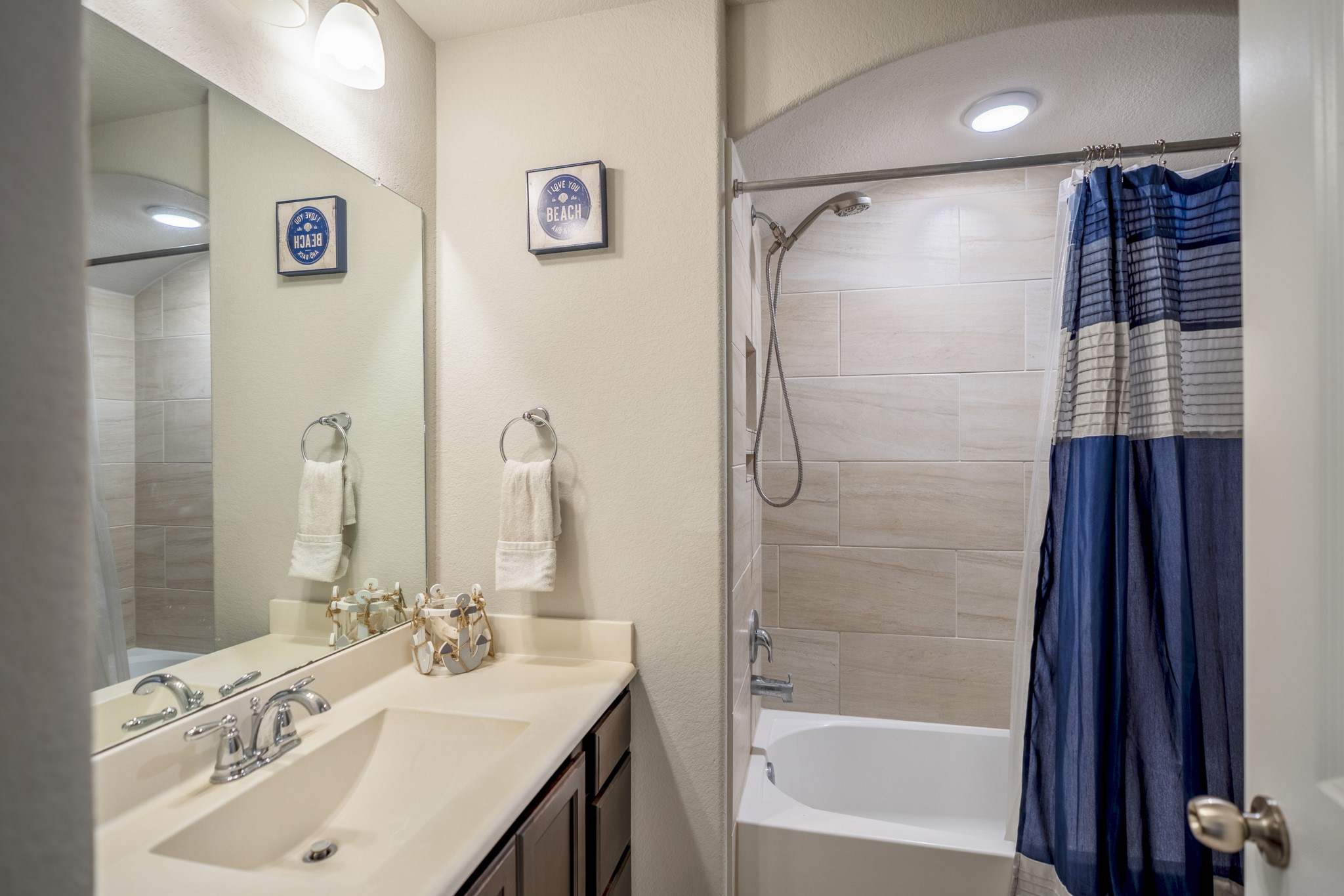 23006 Mulberry Tree Lane Spring, TX 77389 - Photo 33 of 50 a bathroom with a shower sink and mirror