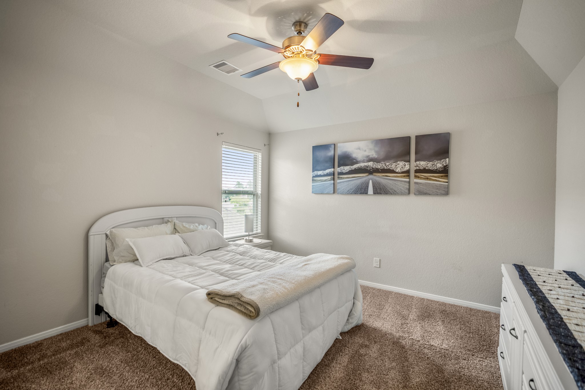 23006 Mulberry Tree Lane Spring, TX 77389 - Photo 37 of 50 a bedroom with a bed and a chandelier