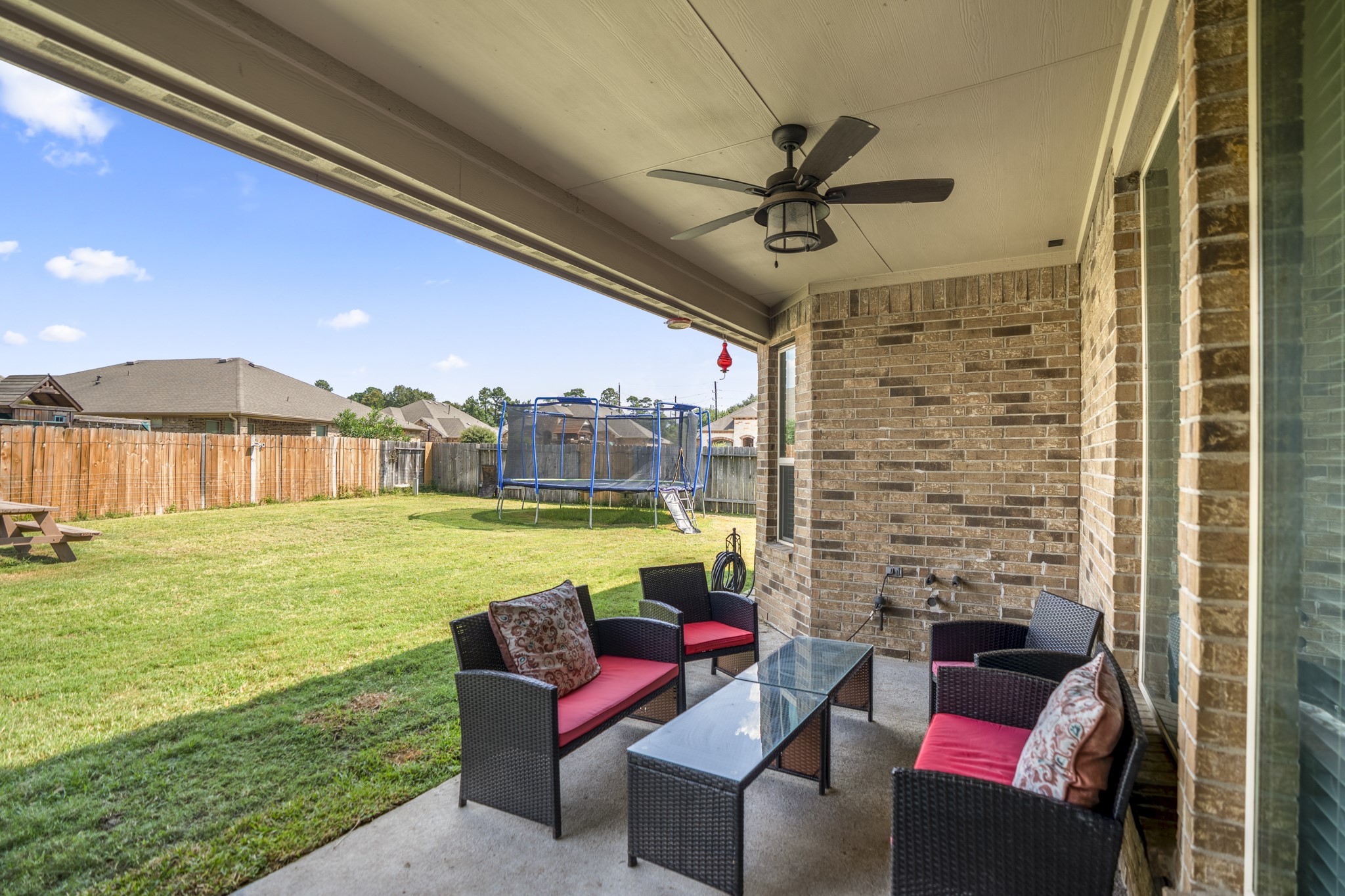 23006 Mulberry Tree Lane Spring, TX 77389 - Photo 38 of 50 a balcony with furniture and a yard