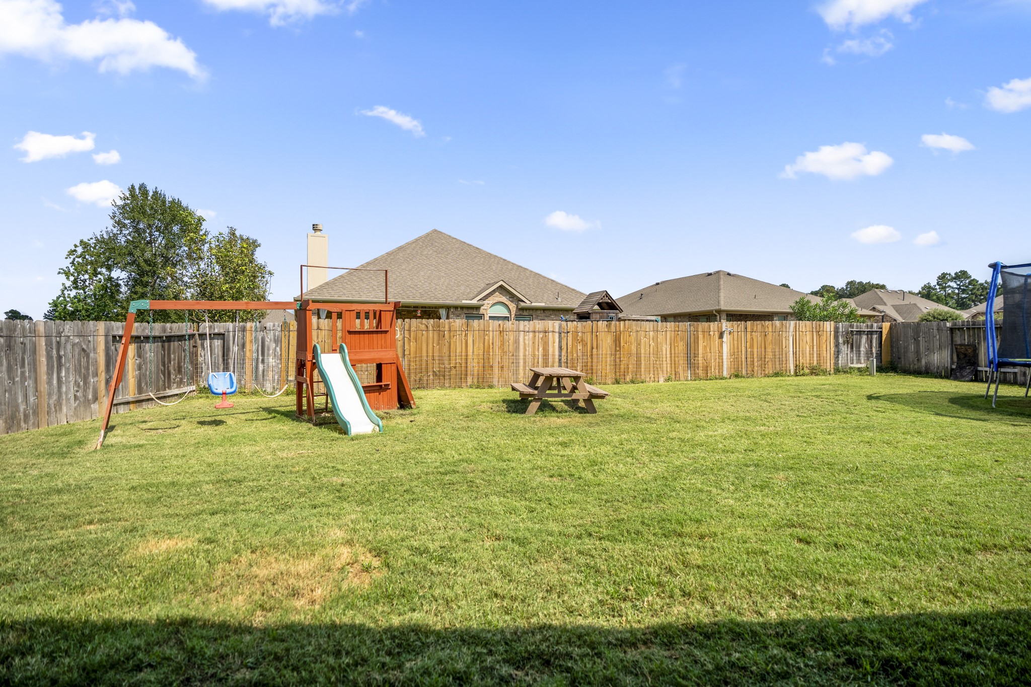 23006 Mulberry Tree Lane Spring, TX 77389 - Photo 40 of 50 a view of a house with backyard and a slide