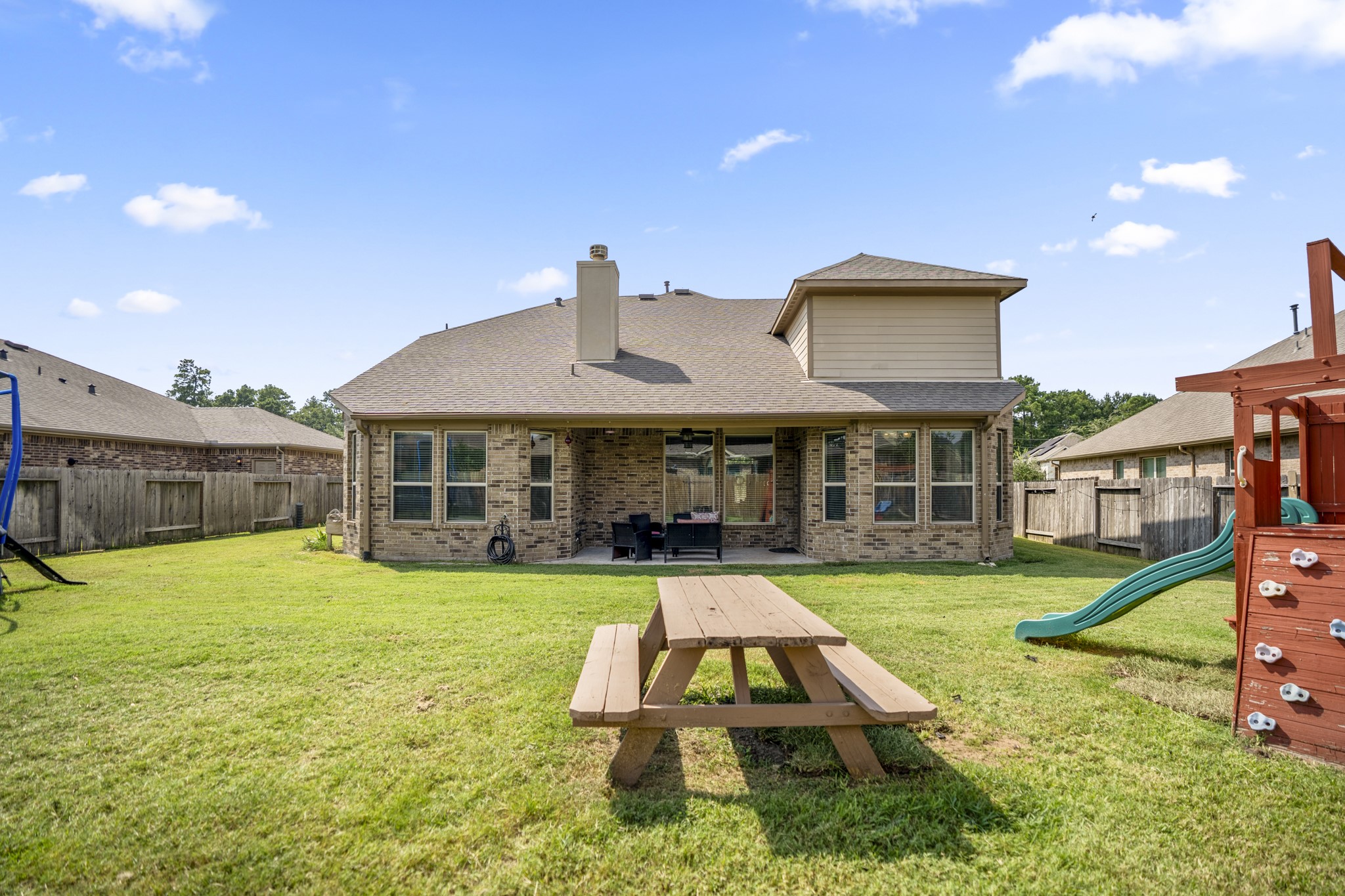 23006 Mulberry Tree Lane Spring, TX 77389 - Photo 41 of 50 a view of a house with a yard and sitting area