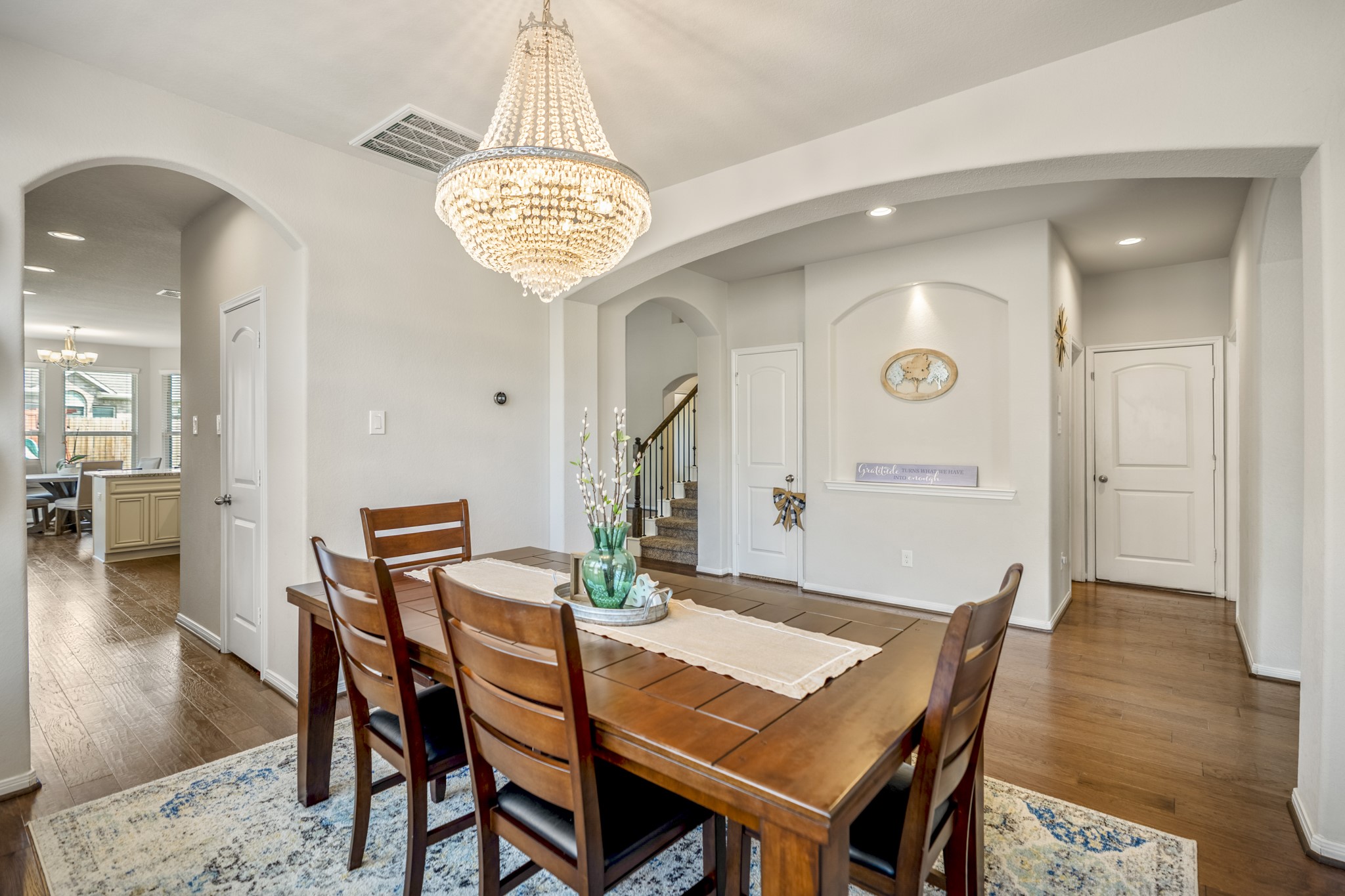 23006 Mulberry Tree Lane Spring, TX 77389 - Photo 10 of 50 a view of a dining room with furniture and wooden floor