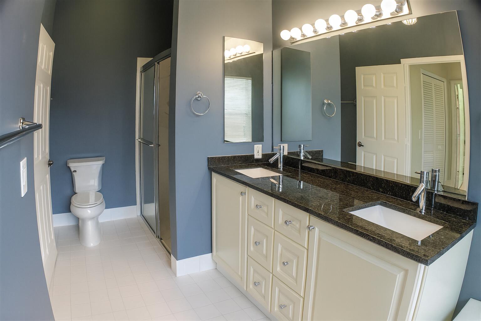 6387 Long Key Lane Boynton Beach, FL 33472 - Photo 20 of 49 a bathroom with a sink and a mirror
