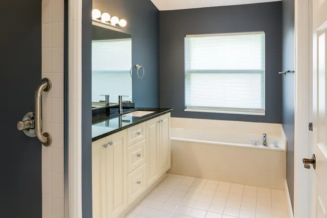 a bathroom with a shower and a shower