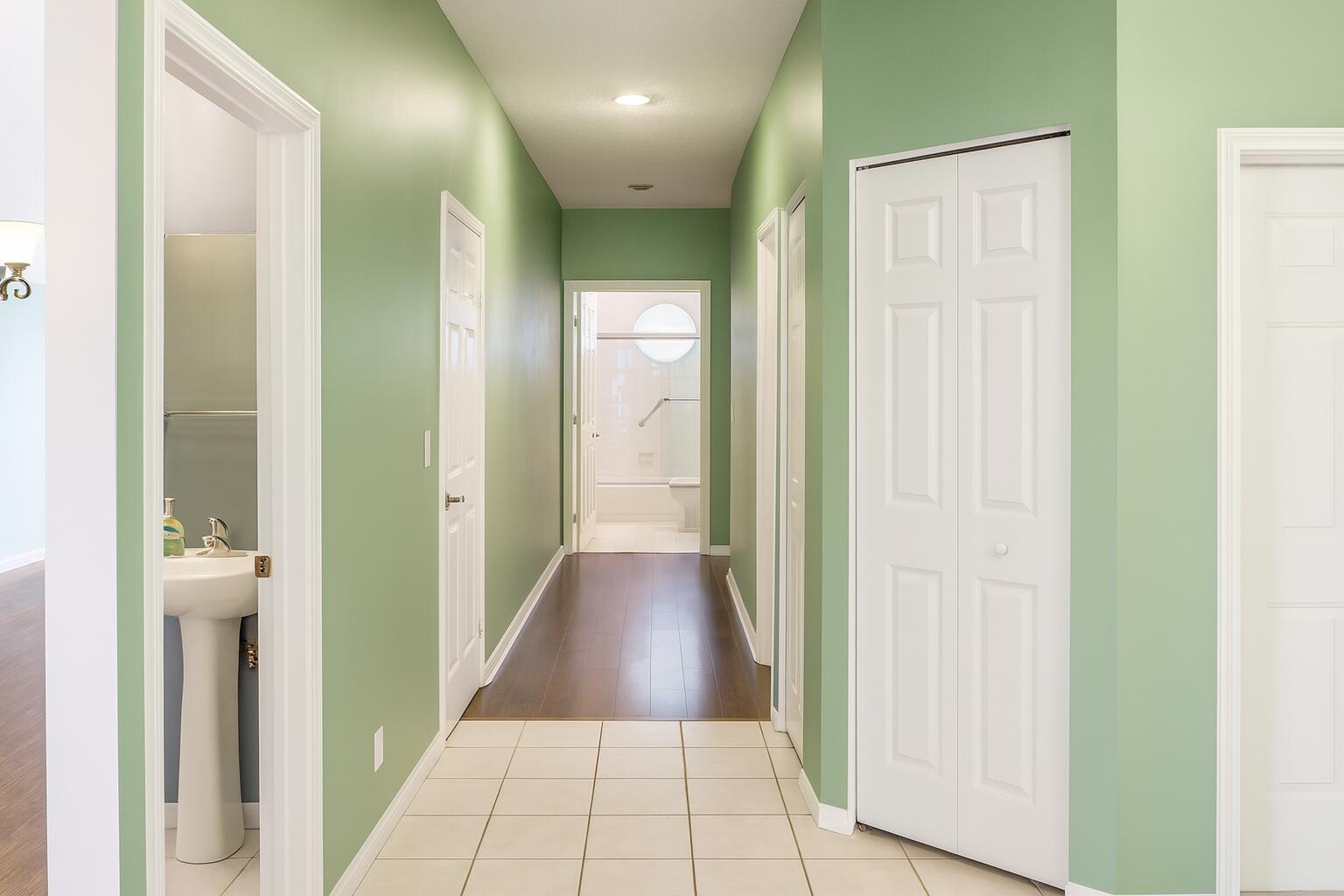 6387 Long Key Lane Boynton Beach, FL 33472 - Photo 25 of 49 a view of a hallway with wooden floor