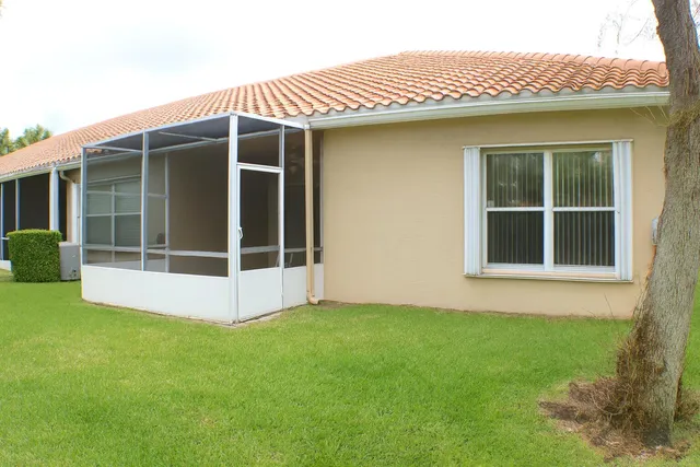 a view of a swimming pool with lounge chairs