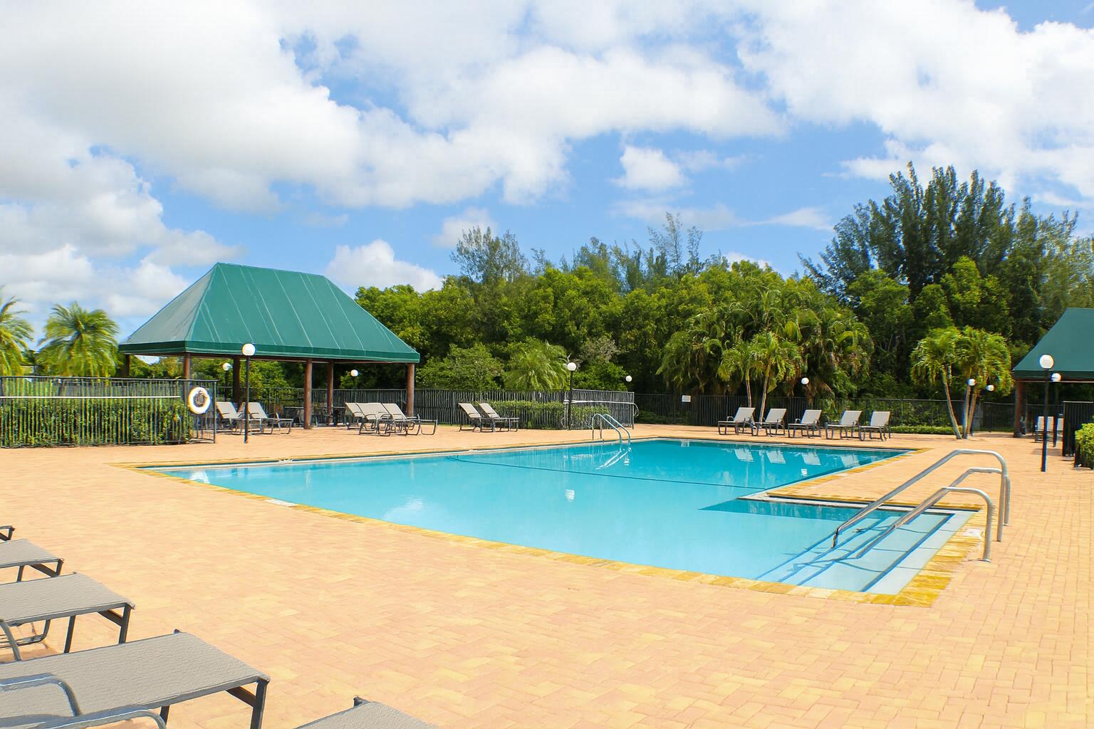 6387 Long Key Lane Boynton Beach, FL 33472 - Photo 40 of 49 a view of a swimming pool with lounge chairs