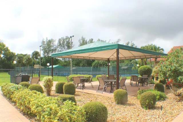 a room with gym equipment and large mirror