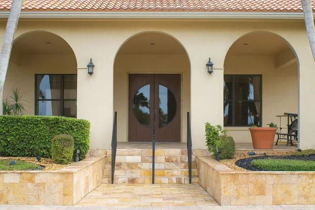a large white kitchen with a large window