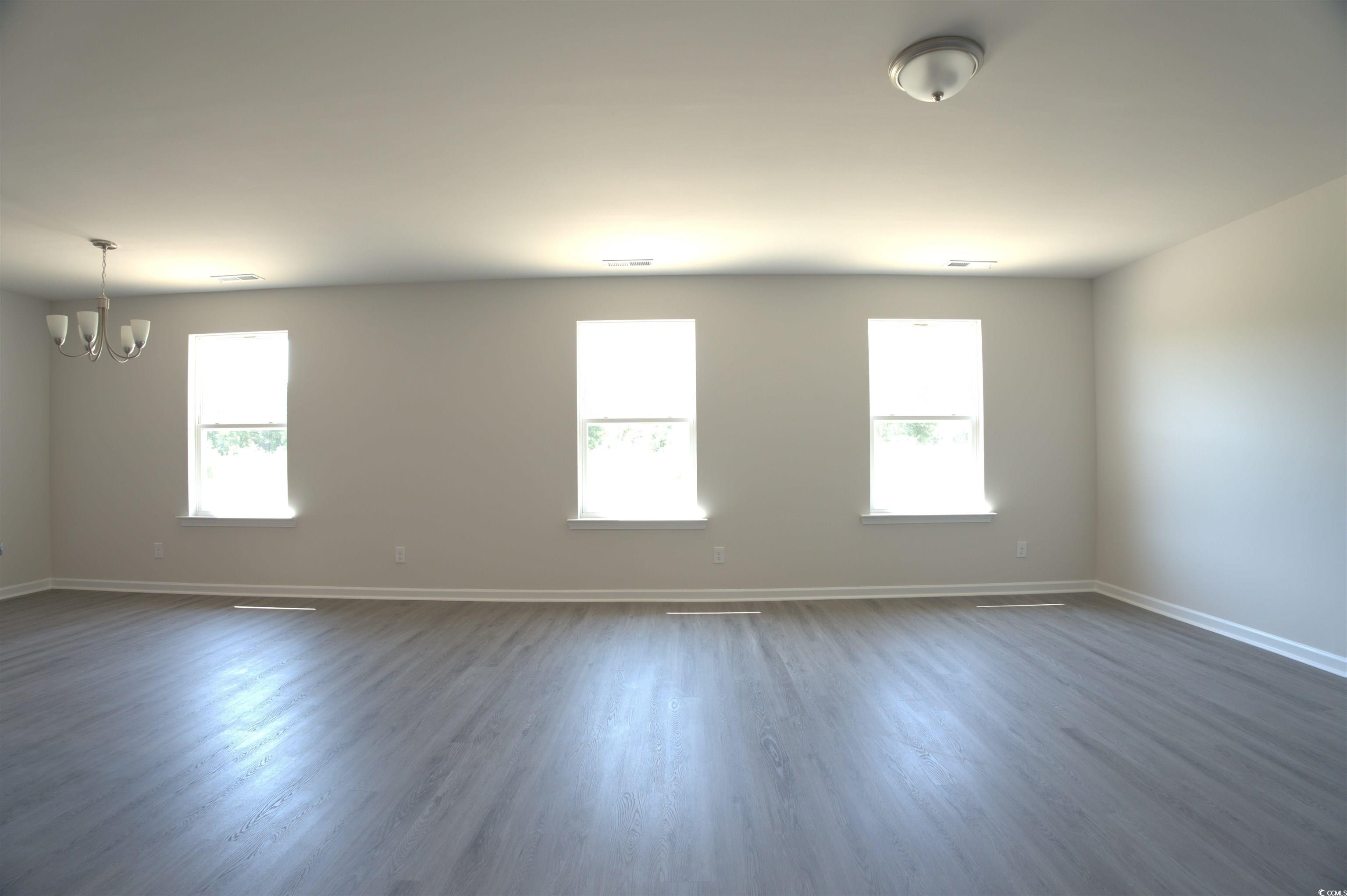 1494 Hardwick Road Conway, SC 29526 - Photo 15 of 33 Carpeted room featuring baseboards, vaulted ceilin